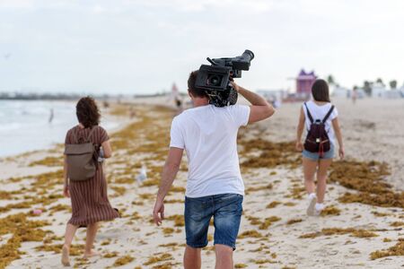 Camera operator with film cameraの写真素材