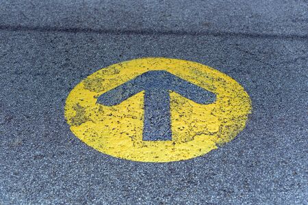 Road sign painted on the asphaltの写真素材