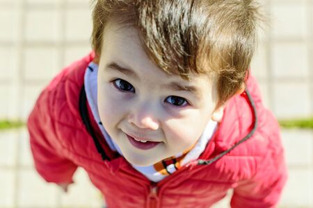 Little boy in red coat