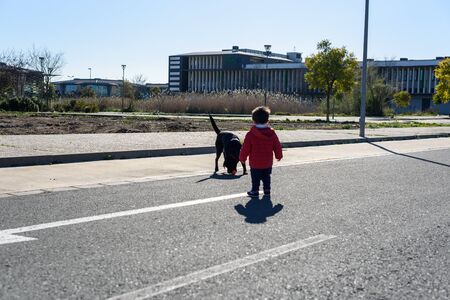Little boy in red coatの写真素材