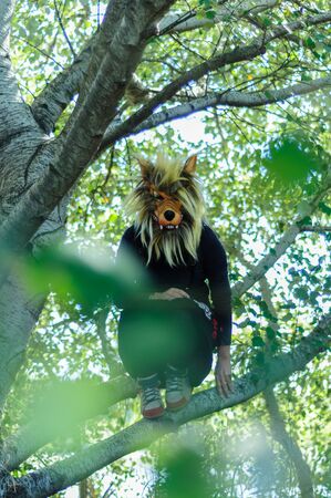 Woman in wolf mask and black dress