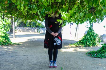 Woman in wolf mask and black dressの写真素材