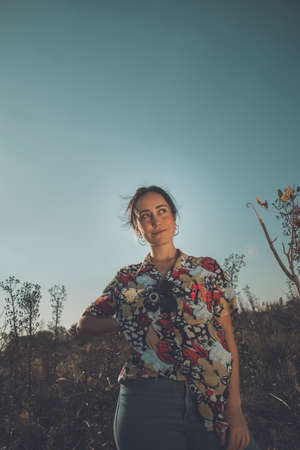 Young free woman in the field full of colorsの写真素材