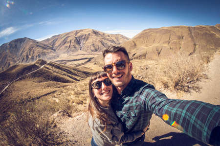 Portrait of happy couple travelingの写真素材