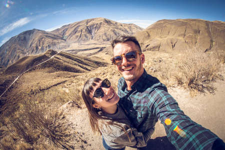 Portrait of happy couple travelingの写真素材