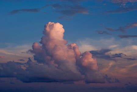 Cumulus Clouds Over the Ocean at Sunset