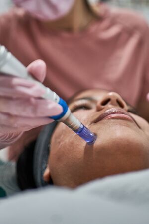 Beauty face skin care. Woman with cosmetic facial mask.