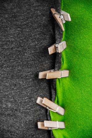 black green coalition clothes with clothespinの写真素材