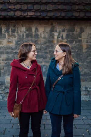 twin sisters having fun in the cityの写真素材