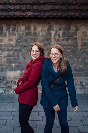 twin sisters having fun in the cityの写真素材