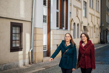 twin sisters having fun in the cityの写真素材