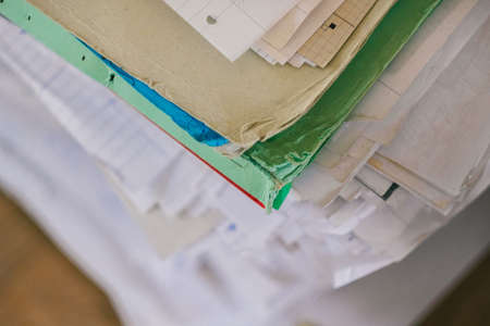 large stack of documents to sort out