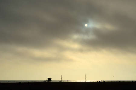 The Sun peaks through the marine layer, at the beach の写真素材