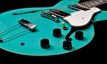 A close view of a hollow body guitar.の写真素材