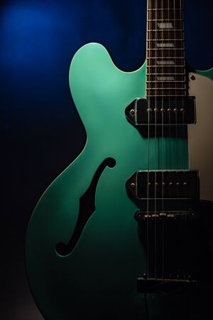 Vintage Guitar with Dark Backgroundの写真素材
