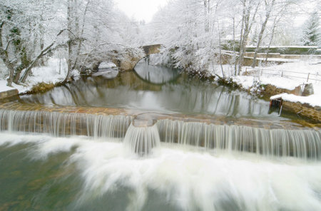 Snow on a bridge of the river Bayas in the Natural Park of Gorbeia, Alava, Pais Vasco, Spainの写真素材