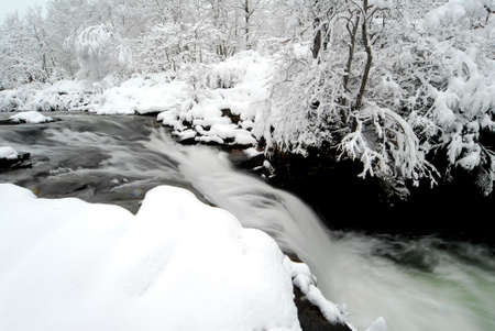 A snowfall covers the Zaldibartxo waterfall in the Bayas river within the Gorbeia Natural Parkの写真素材