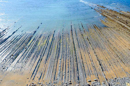 The flysch in the bay of Sakoneta, Deba, Pais Vasco, Spainの写真素材