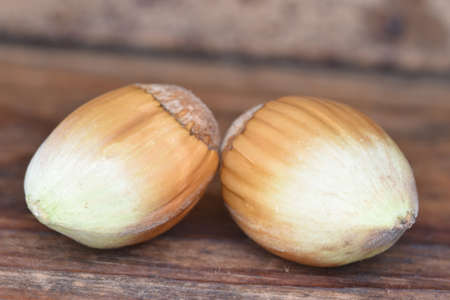 Hazelnut composition with a wooden background