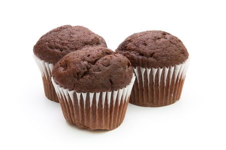Three chocolate muffins isolated on white backgroundの写真素材