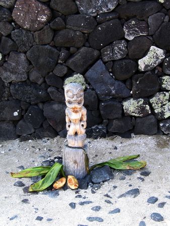 Wooden tiki idol with offeringsの写真素材