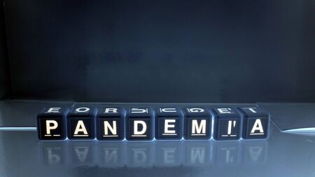 The word pandemic in Italian, Portuguese and Spanish.の写真素材