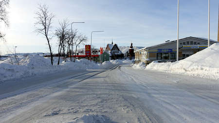 Kiruna, Sweden, February 23, 2020. One of the snowy streets in the center during the winter. In the background you can see the church of the cityのeditorial素材