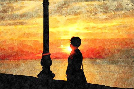 The silhouette of a woman near a street lamp contemplating the sunset on the horizon. Digital...
