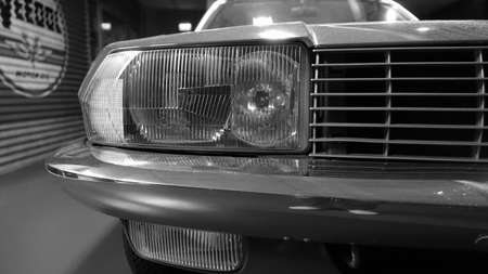Turin, Italy - June 20, 2021: a headlight of an antique car at the Automobile Museum