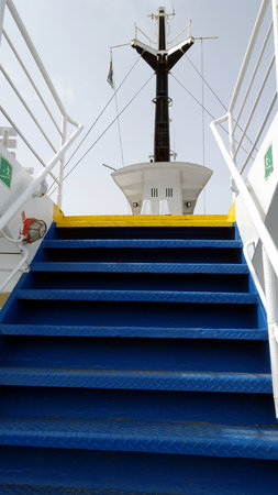 The stairs of a ferry in Italy towards the Mediterranean islands.の写真素材