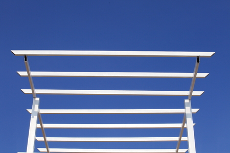 White colour structure of roof on the blue skyの写真素材