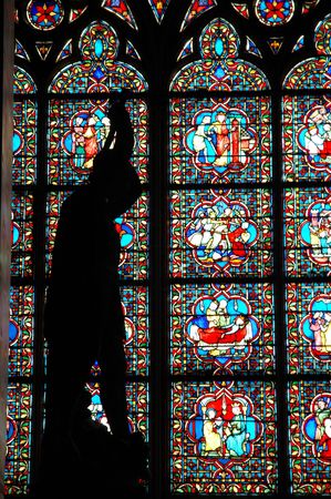 Stained Glass with Statue Silouetteの写真素材