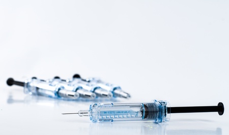 Photograph of syringes isolated on whiteの写真素材