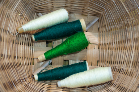 old tool to make the thread bobbin for the shuttle of ancient loom and Cotton is raw for weave, tools to work natural textile fiberの写真素材