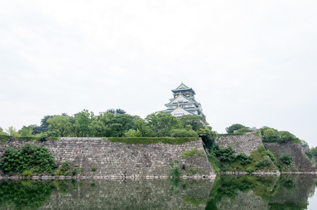 Osaka Castle with dramatic cloudy skies in Osaka, Japan.のeditorial素材