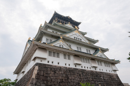 Osaka Castle with dramatic cloudy skies in Osaka, Japan.のeditorial素材