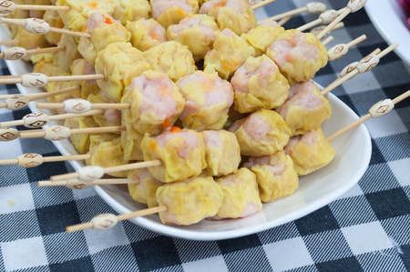 Chinese Steamed Dumpling on fabric pattern backgroundの写真素材