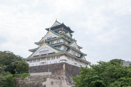 Osaka Castle with dramatic cloudy skies in Osaka, Japan.のeditorial素材