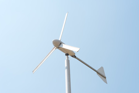 Wind energy turbine power station on clear blue skyの写真素材