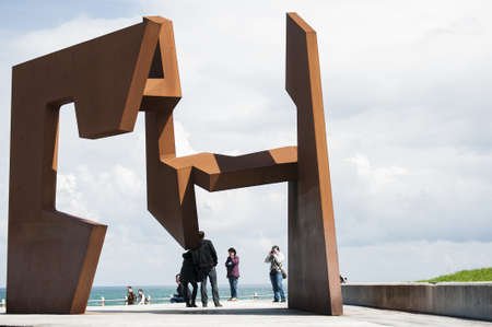 People shooting to big sculpture in Donostiのeditorial素材