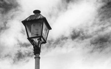 Broken streetlight with cloudy skyの写真素材