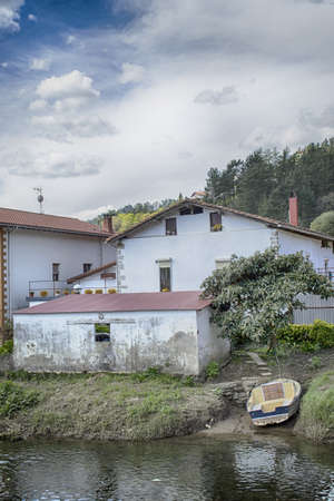 Boat on the bank of a riverの写真素材
