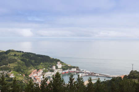 Panoramic of a fishing village from the mountainsの写真素材