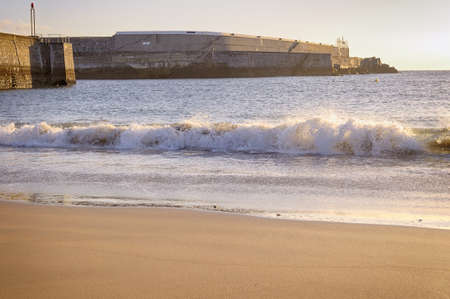 Waves on the beach in the morningの写真素材