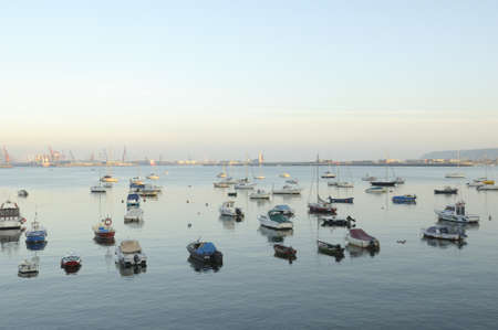 Boats in the harbor at dawnの写真素材