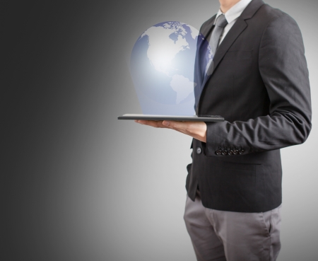 business man drawing social network or business connection with world map on white boardの写真素材