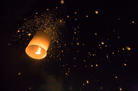 People release sky lanterns to worship Buddha's relics in Yi Peng festival on November 8,2008 in Chiangmai,Thailand. This festival occurs on every the 12th Thai lunar month.の写真素材