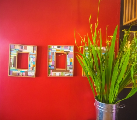 frames on red wallの写真素材