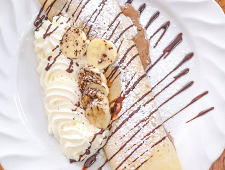 Cold crape with ice-cream chocolate and bananaの写真素材