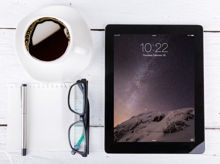 Chiang mai,THAILAND Fab 25, 2015:Apple iPad displaying iOS 8 homescreen. iOS 8 mobile operating system designed by Apple Inc. is an upcoming September 17, 2014.のeditorial素材